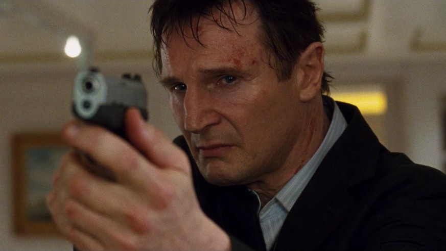Liam Neeson pointing a gun