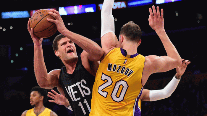 Brook Lopez goes up for a lay-up against Timofey Mozgov. (Photo: Getty Images)