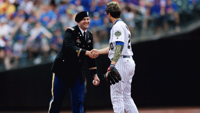 Mets second baseman Neil Walker shakes hands with a veteran on Memorial Day, 2016. (Photo: Getty Images)