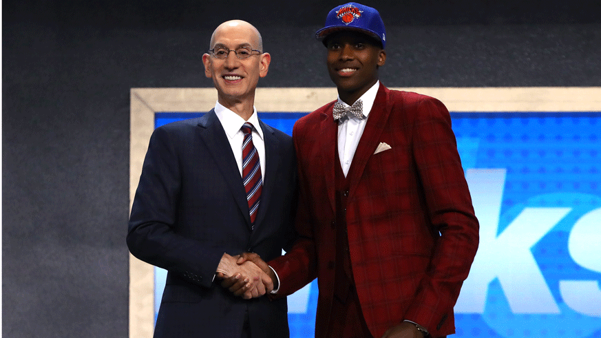 NBA commissioner Adam Silver (left) and Frank Ntilikina after the Knicks selected him No. 8 overall in the 2017 NBA draft. (Photo: Getty Images)