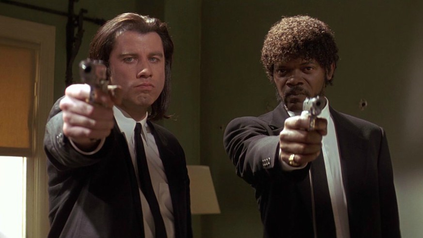 John Travolta and Samuel L. Jackson pointing their guns