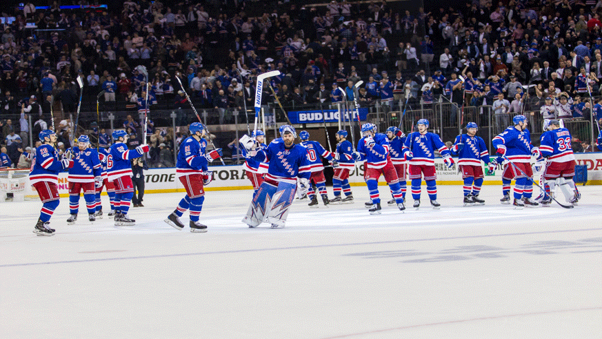 The Rangers salute the crowd after their 4-1 win in Game 3 of the Eastern Conference semifinals against the Senators. (Getty Images)