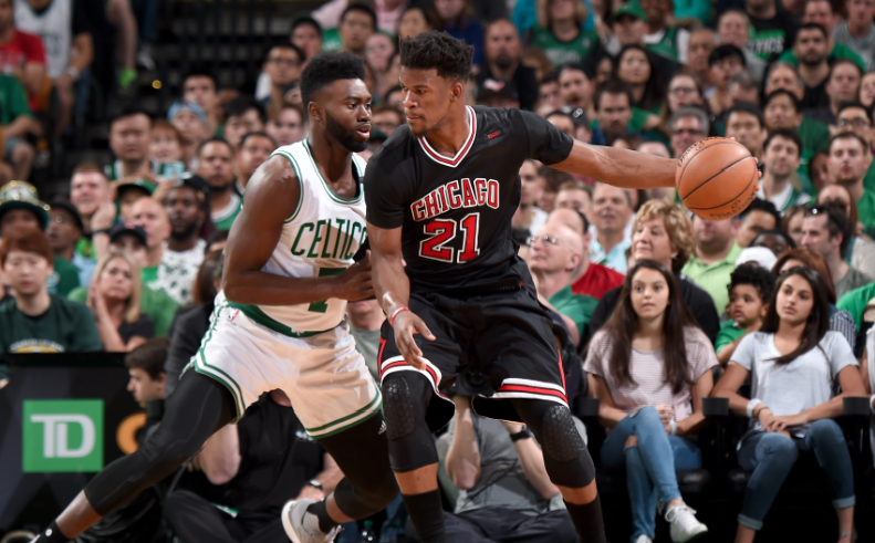 Jimmy Butler posts up Jaylen Brown Sunday night as the Celtics took on the Bulls. Getty Images