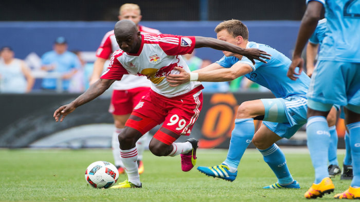Bradley Wright Phillips shakes off a NYCFC defender during a game at Yankee Stadium. (Getty Images)