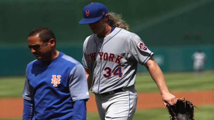 Mets pitcher Noah Syndergaard walks off the mount after injuring his lat against the Washington Nationals. (Getty Images)