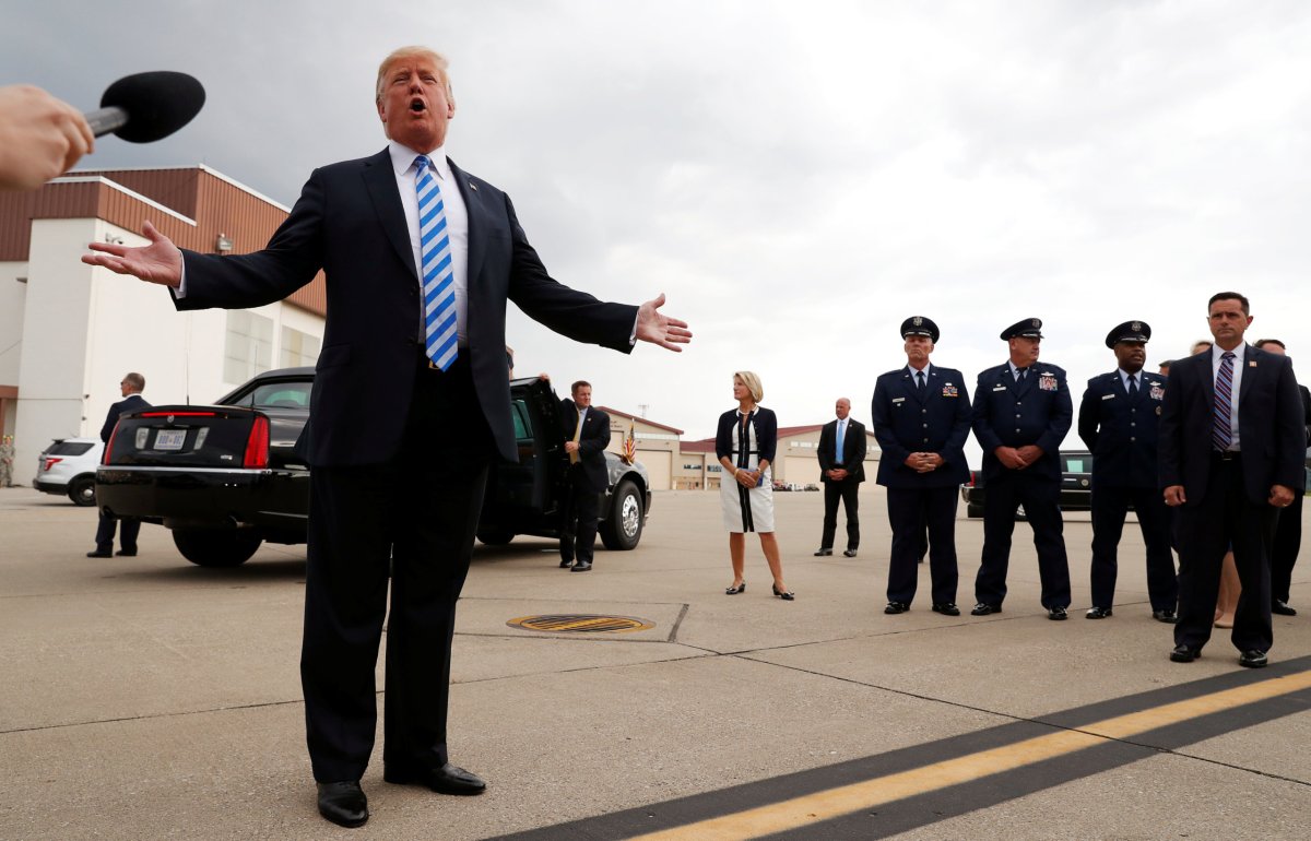Trump speaks to the news media on the airport tarmac about the federal conviction of his former presidential campaign chairman Paul Manafort as the president arrives for a campaign event in Charleston, West Virginia. Photo: Reuters