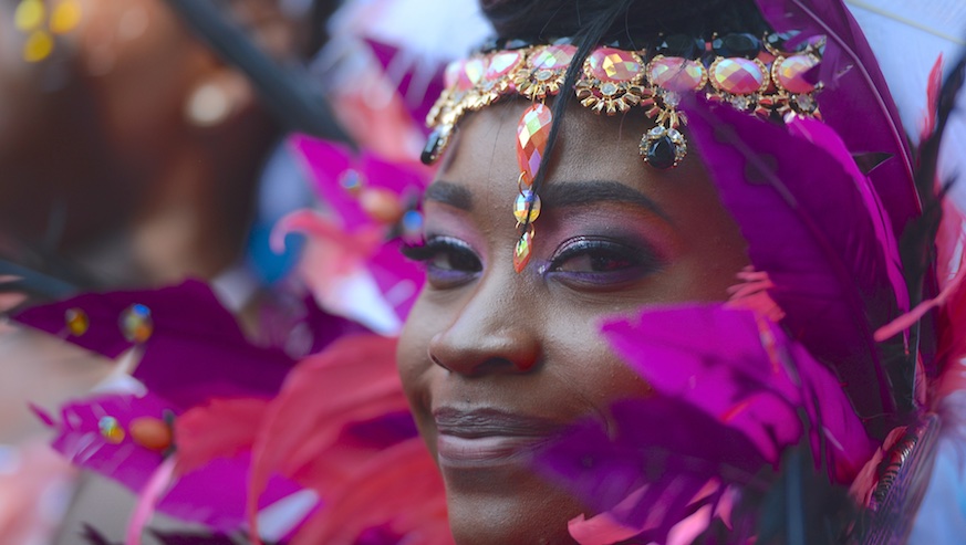 A West Indian Day Parade dancer smiles while in costume on September 4, 2017. Getty Images