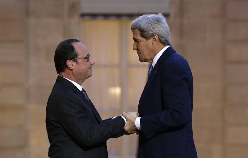 Dozen arrested over Paris shootings as John Kerry comes to give “big hug”