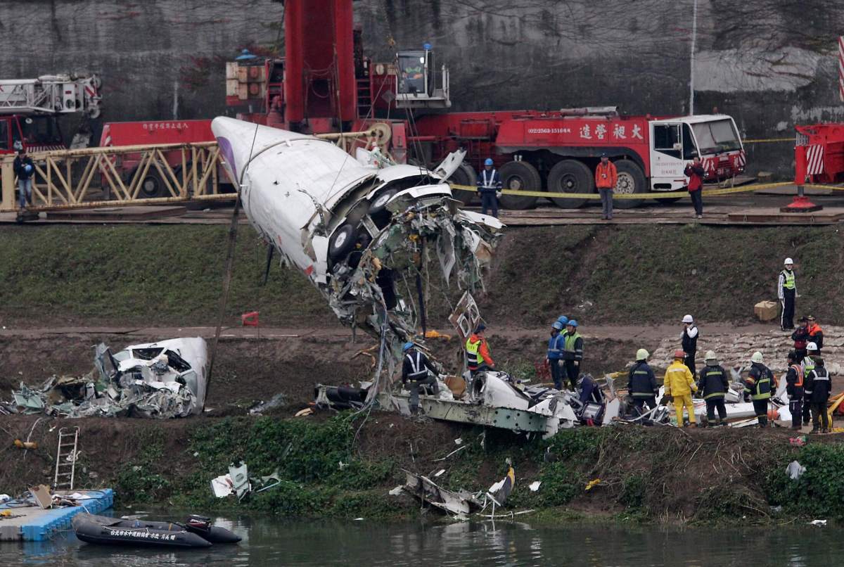 Body of Taiwan crash hero pilot found still clinging to plane controls