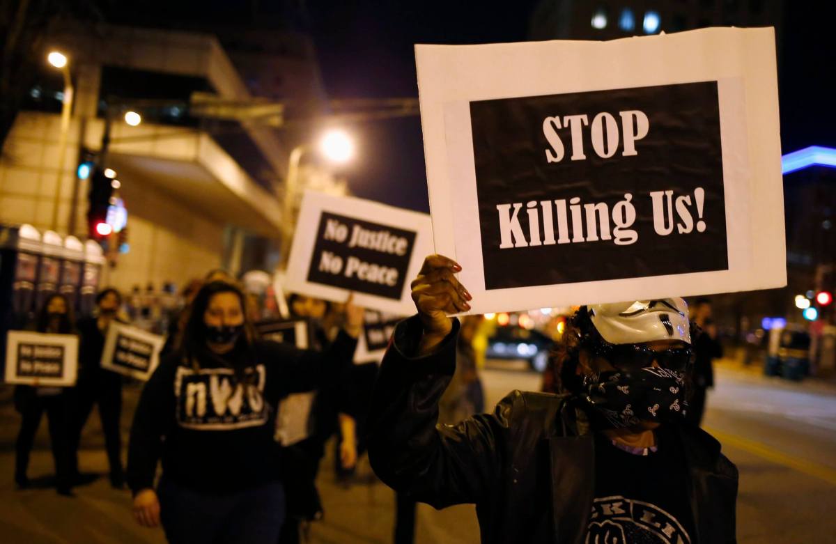 Suspect charged over Ferguson protest cop shootings