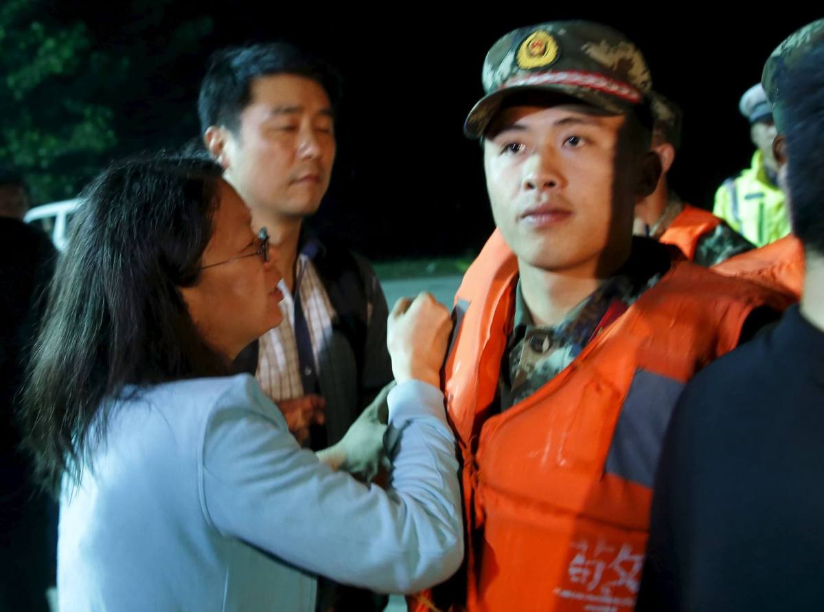 China shipwreck families storm police line as owner’s fleet examined