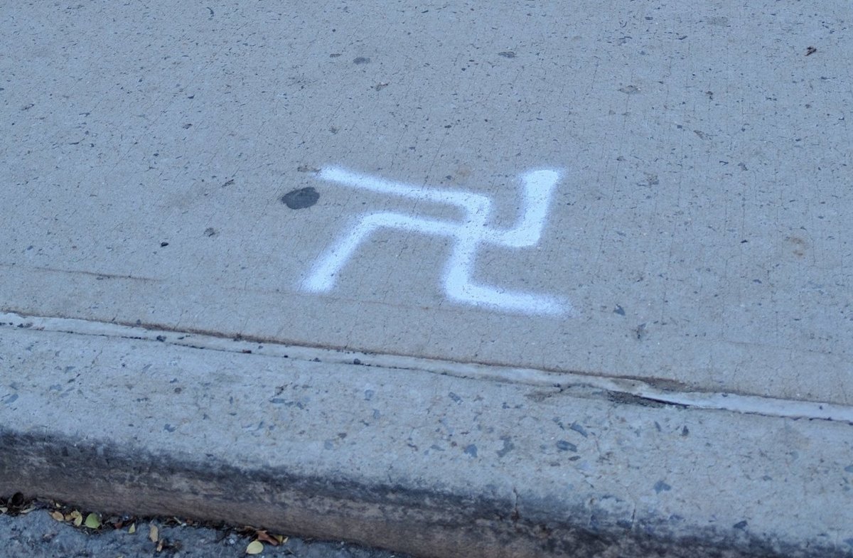 Swastika painted, crossed out, on Crown Heights sidewalk