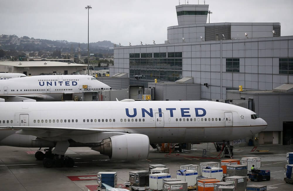 United fires flight attendant who exited plane via emergency slide