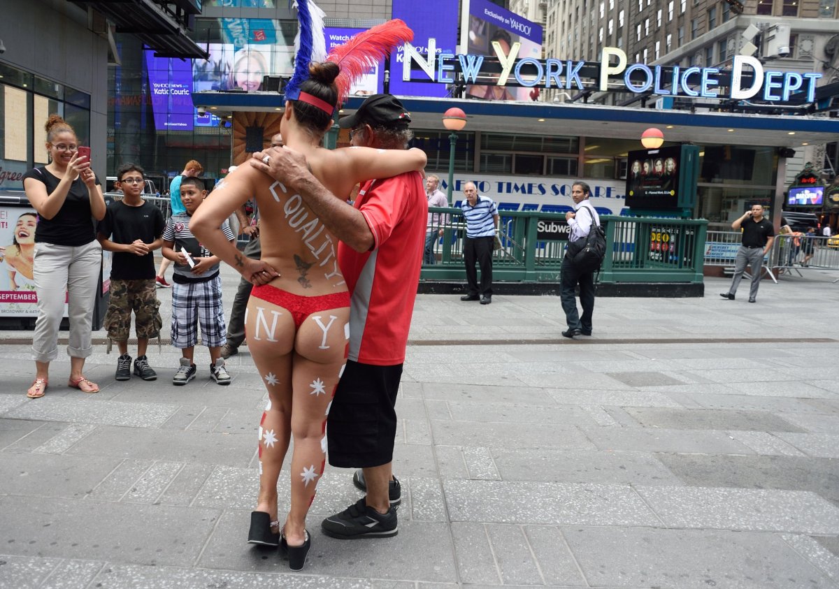 City attempts to control desnudas, costumed characters as warm weather