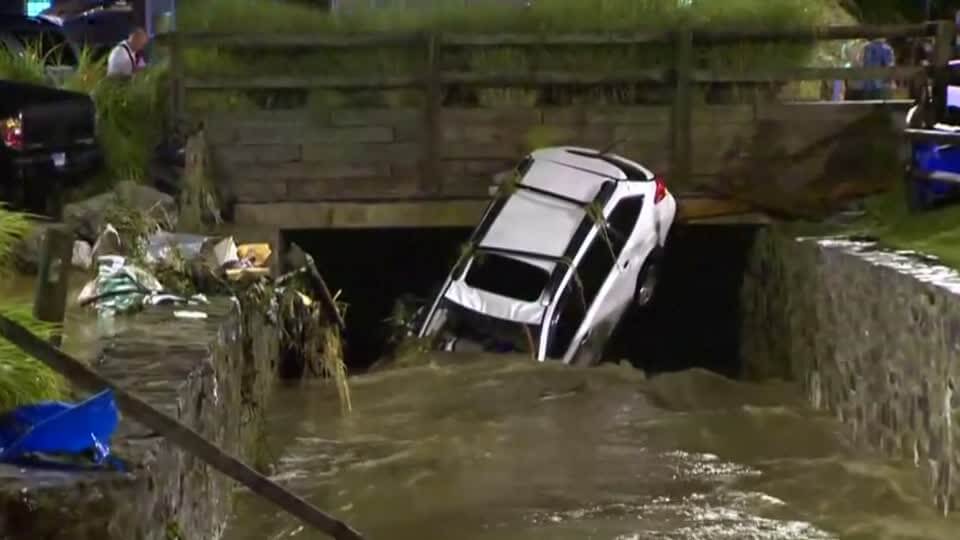 Two dead as flood tears through Maryland downtown