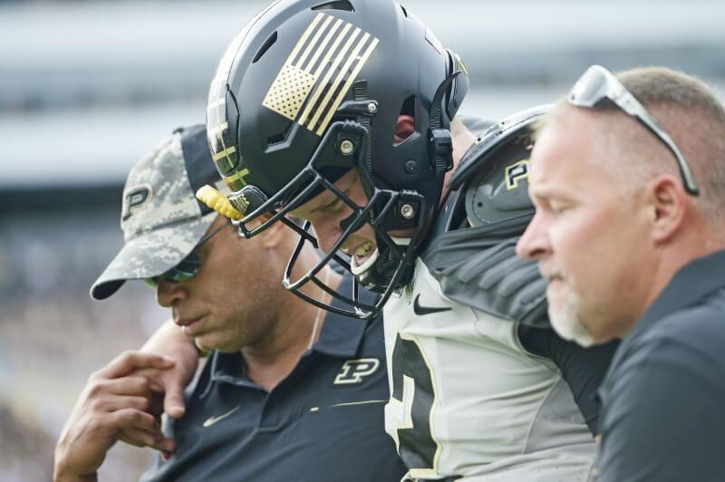 College football notebook: One play, two injured for Purdue