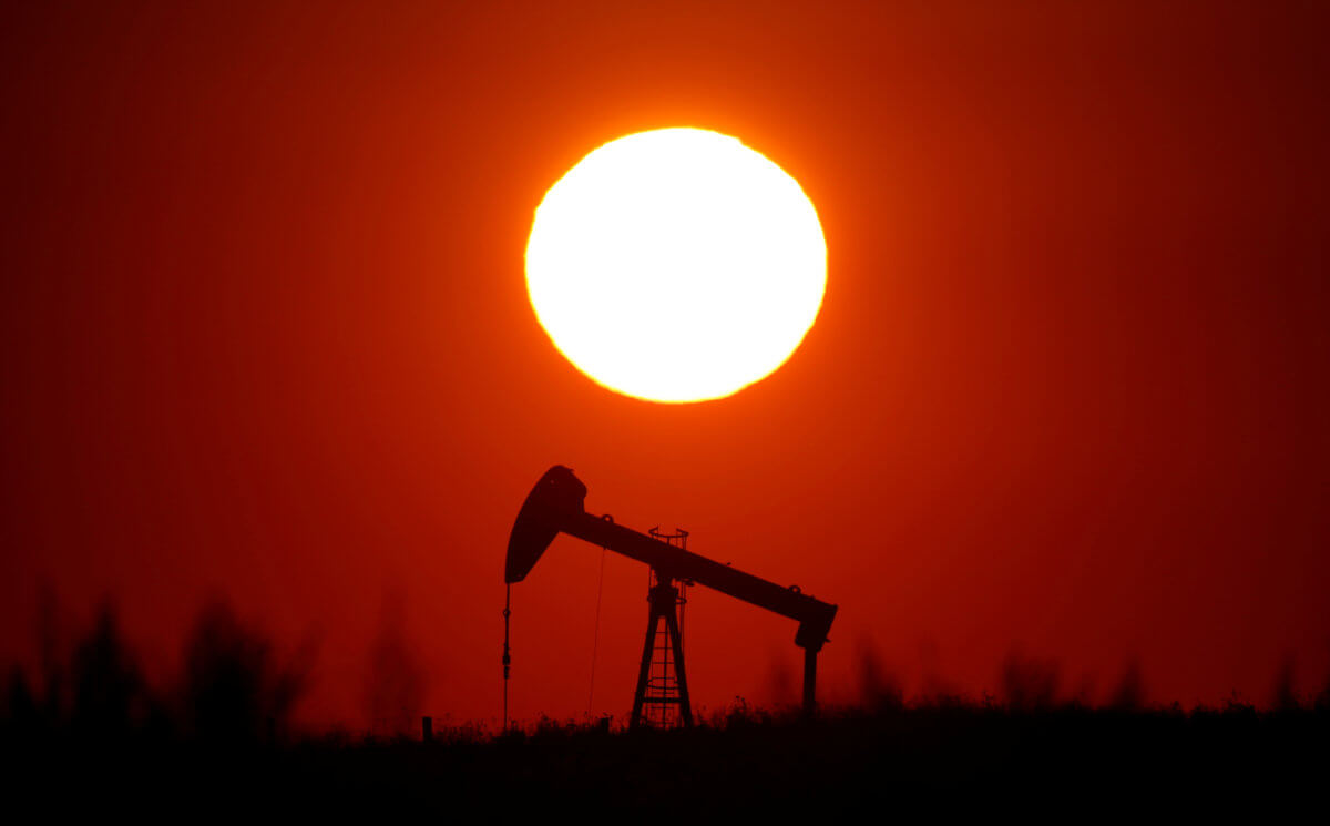 Oil rises on hopes OPEC will extend supply cuts, weaker U.S. dollar