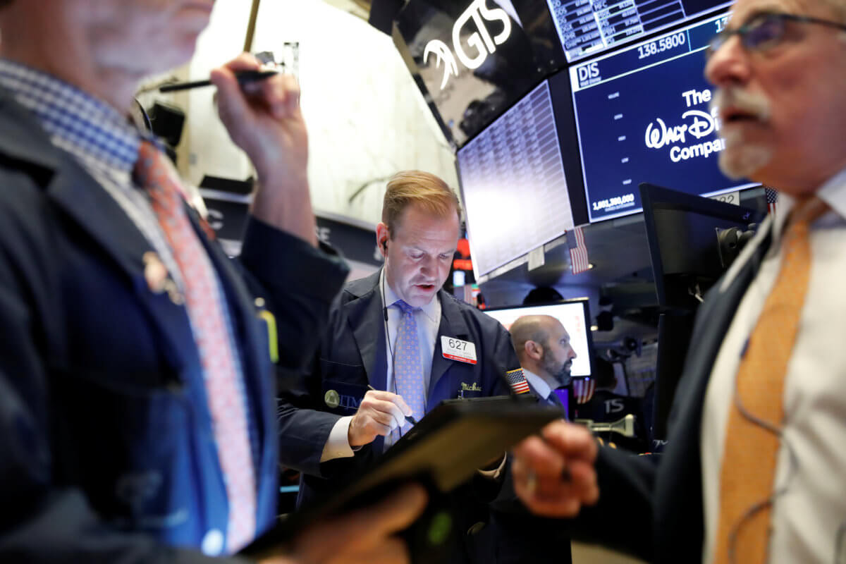 Trade hopes propel Wall Street to records; healthcare climbs