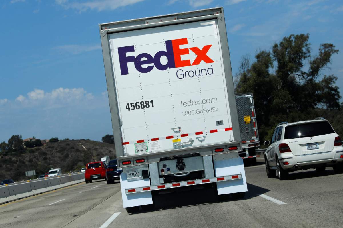 FedEx cuts 2020 profit forecast – again – as seven-day delivery costs weigh