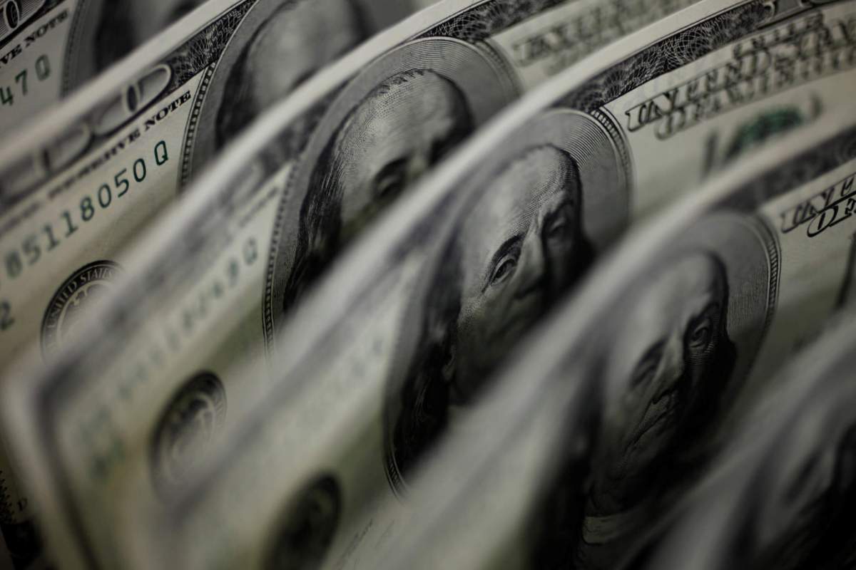 Dollar dented as risk appetite returns at year-end