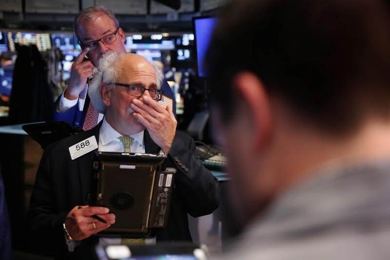 Weak jobs report weighs on Wall Street, bank shares