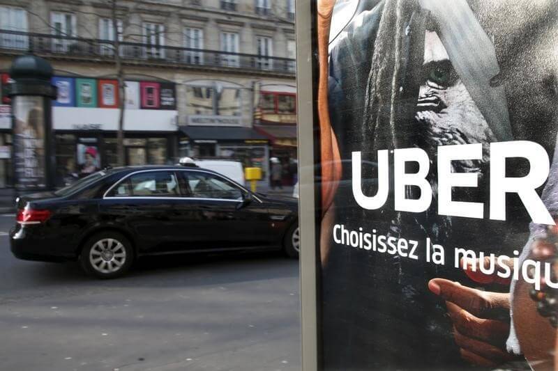 French court fines Uber, execs for illegal taxi service