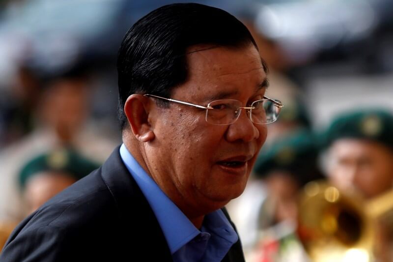 Cambodia PM shrugs off EU aid threat, opposition supporters jailed
