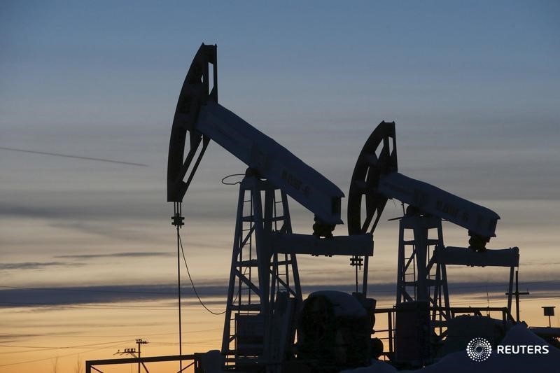 Oil settles up 5 percent, trims gains after hours on API report