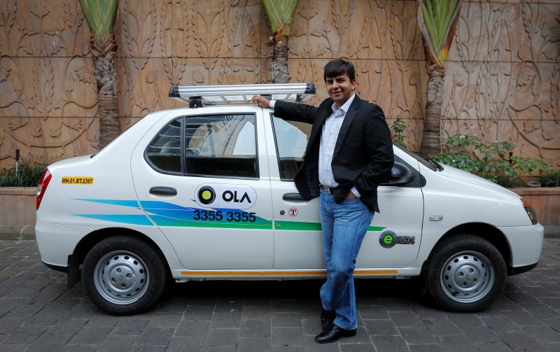 India ride-hailing firm Ola sideswiped as Uber, Didi team up in China