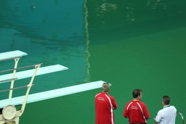 Bright green Olympic pool overshadows events