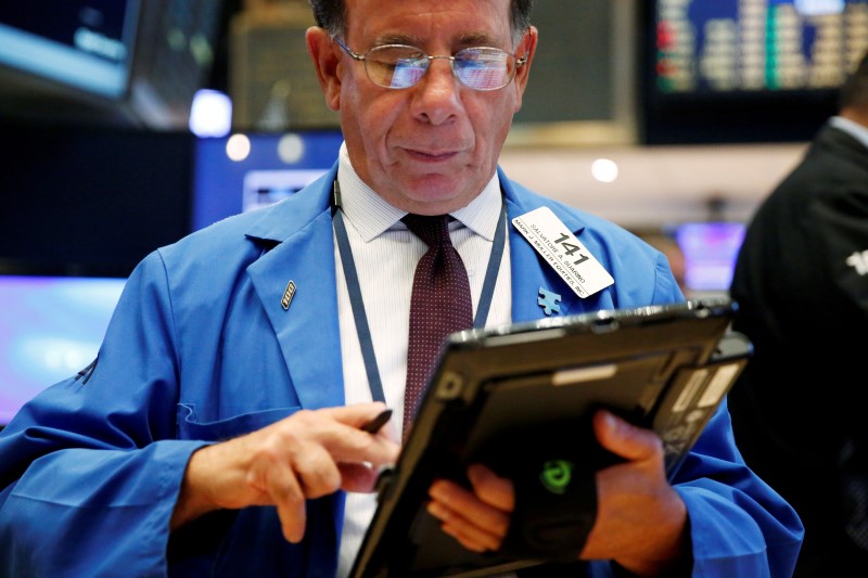 Oil fizzles on crude build; Wall St. ends lower
