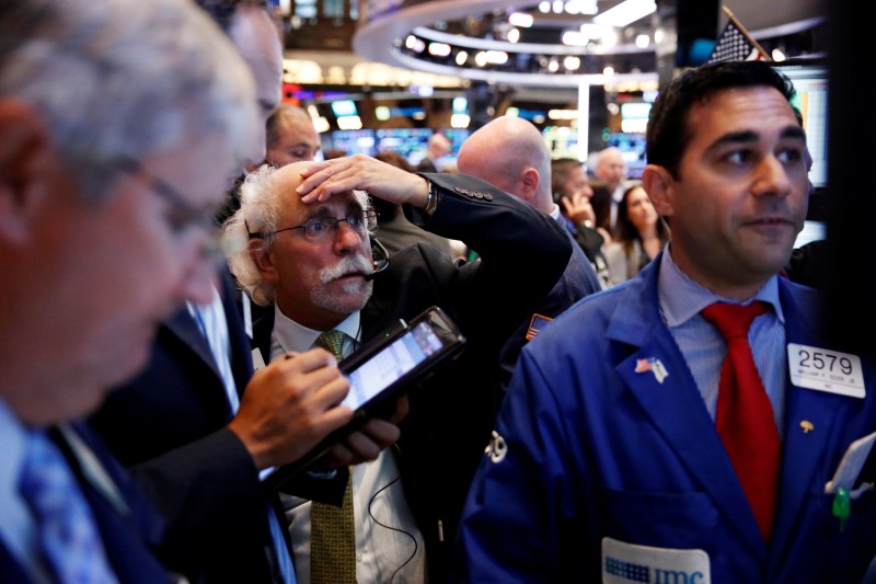 Oil surges 4 percent, helping Wall St. hit record peaks