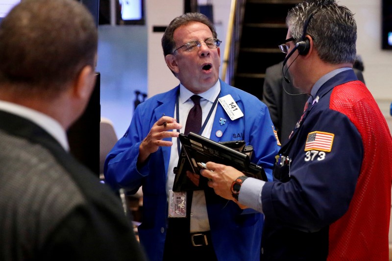 Wall St. ends at record highs; commodity shares climb