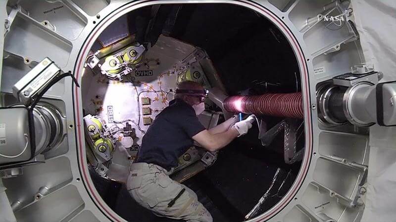 U.S. astronauts prepare station for commercial space taxis