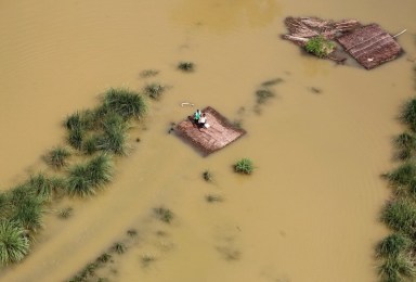 Eastern India struggles to evacuate reluctant villagers as floods wreak havoc