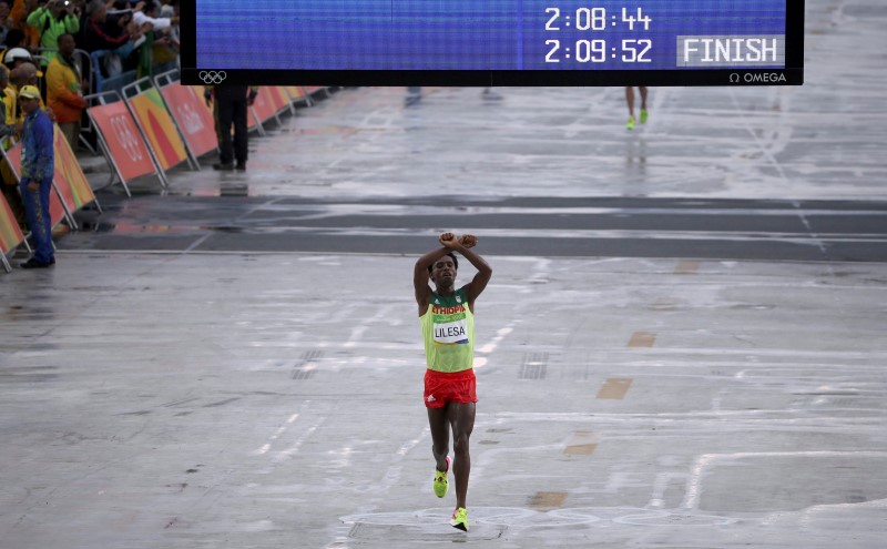 Ethiopian marathon medalist stays put in Rio, vows to fight for land rights