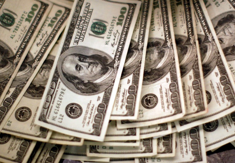 Dollar gives up gains as jobs data in focus