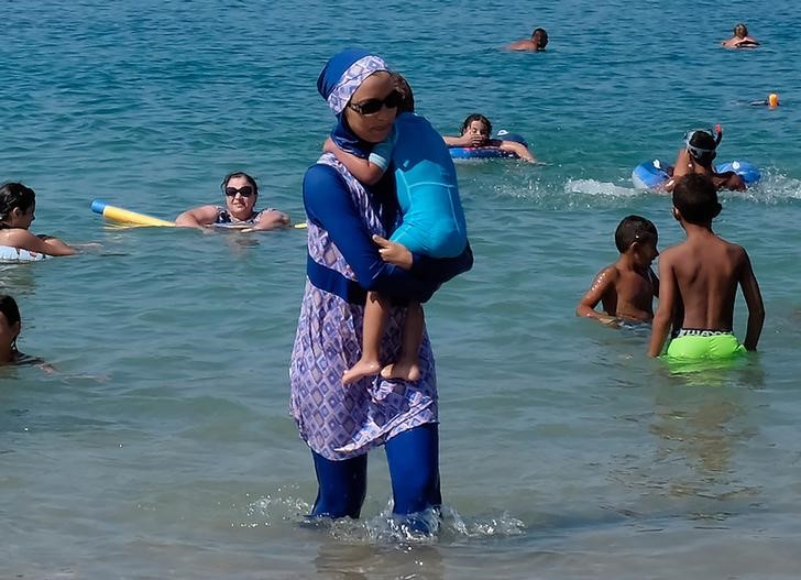 U.N. rights office urges French towns to repeal burkini bans