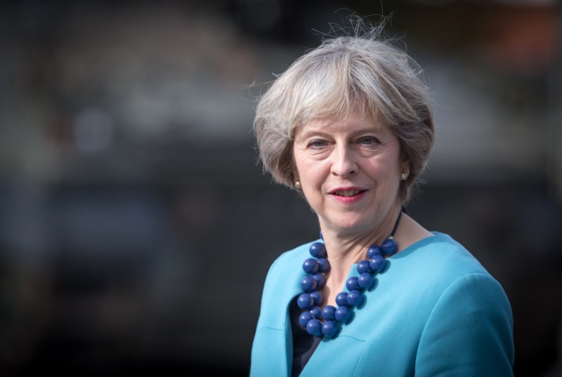 Pro-Brexit Conservatives hand PM plan to limit EU immigration