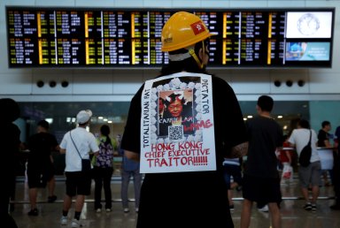 Protesters flock to Hong Kong’s airport as political crisis simmers on