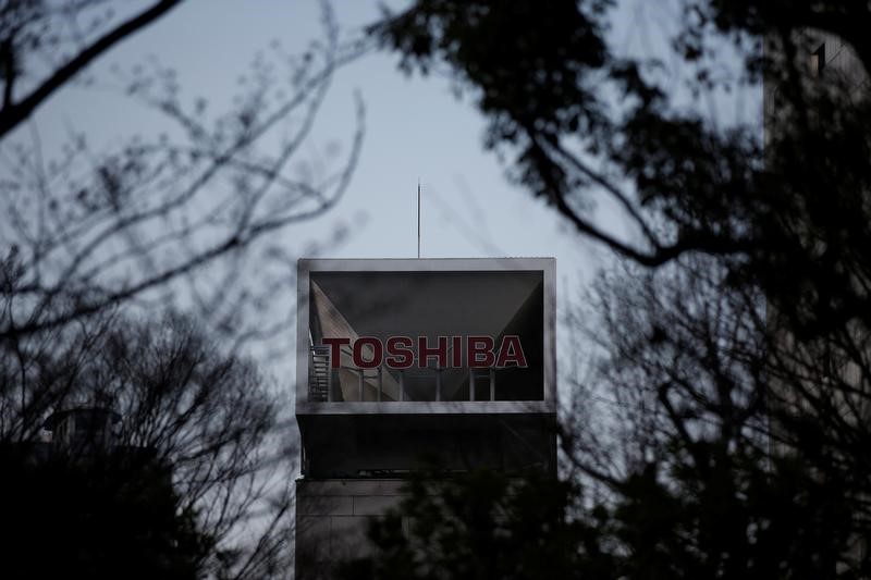 Toshiba quarterly profit jumps on cost cuts, but misses estimates
