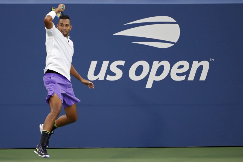 Kyrgios brushes off collar row to reach third round