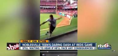 Reds fan runs onto field, jumps wall, escapes stadium (Video)