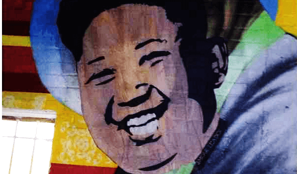 Artist Smear Leader plasters Kim Jong Un’s face over Bill Cosby mural in D.C.