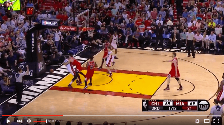 Bulls player Doug McDermott tackles Heat big man Hassan Whiteside (YouTube
