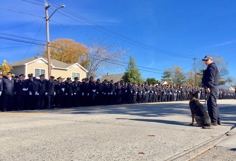 Thousands pay tribute to slain officer