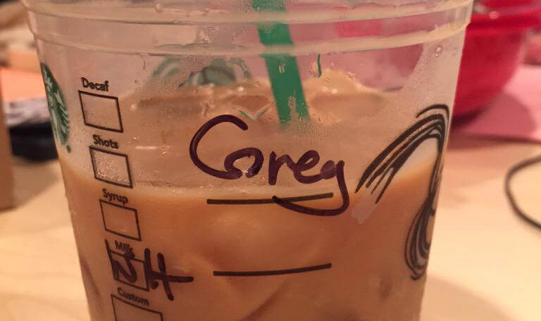 Does the name on this Starbucks cup say ‘Greg’ or ‘Corey?’
