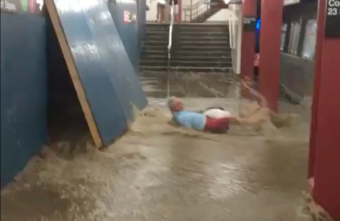 Man falls to ground, nearly swept away by water at station