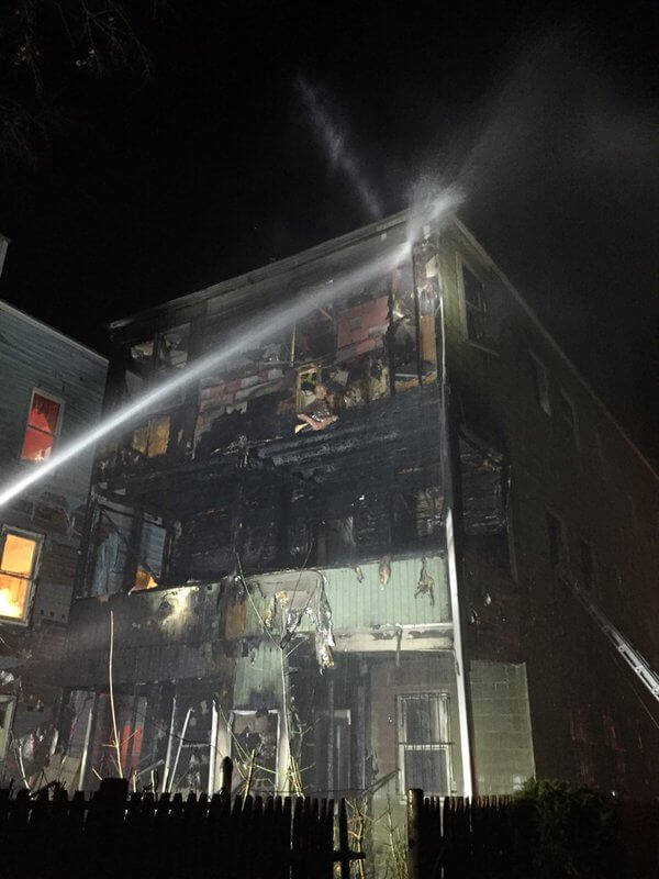 Fire tears through Roxbury triple-decker’s porches