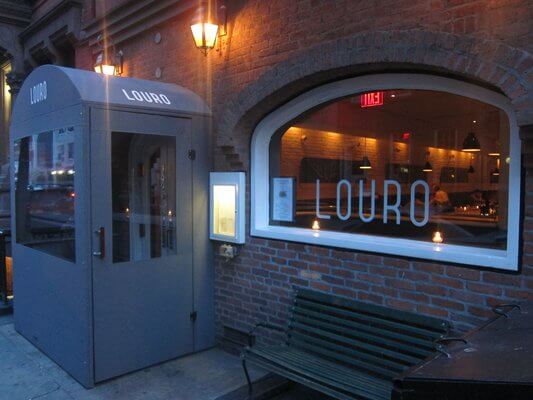 Raise a sad, half-priced drink at Louro
